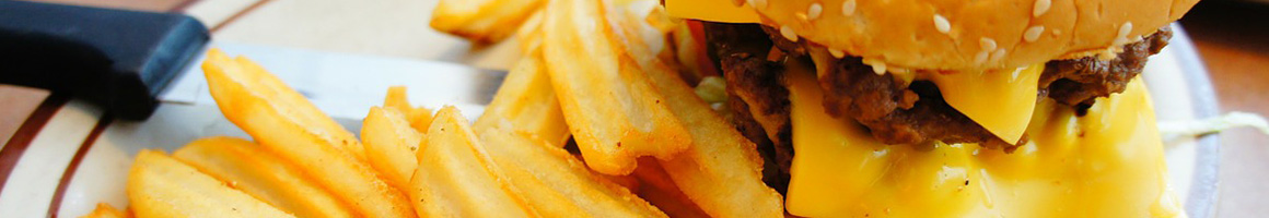 Eating Burger at Tam's Burgers restaurant in Paramount, CA.